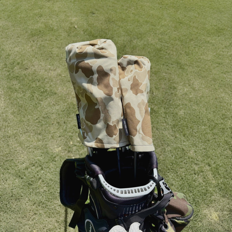 The Beach Side desert frogskin camo headcovers on driver and wood in golf bag on course