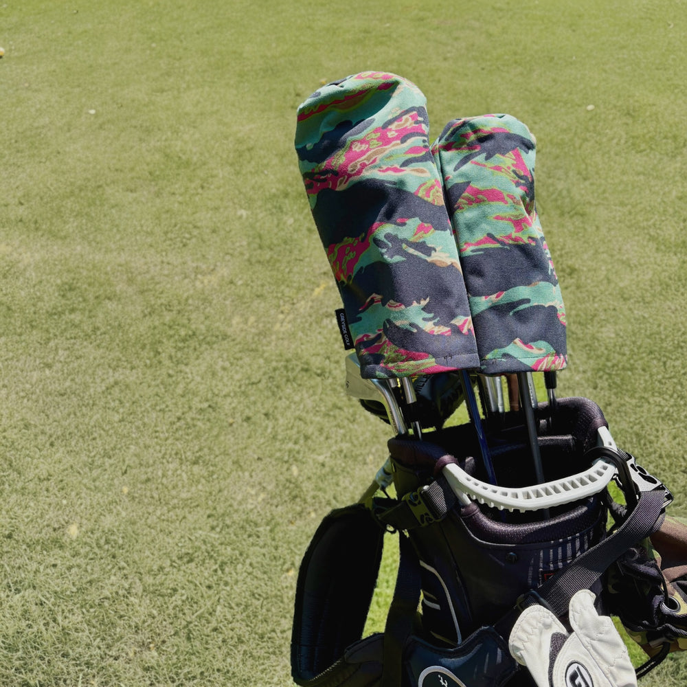 The Del Mar Miami Vice tiger stripe camo headcovers on driver and wood in golf bag on course
