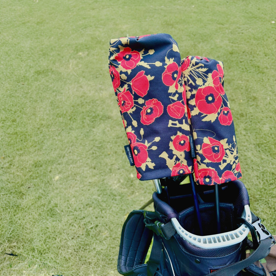 Poppies of War red poppy print headcovers on driver and wood in golf bag on course