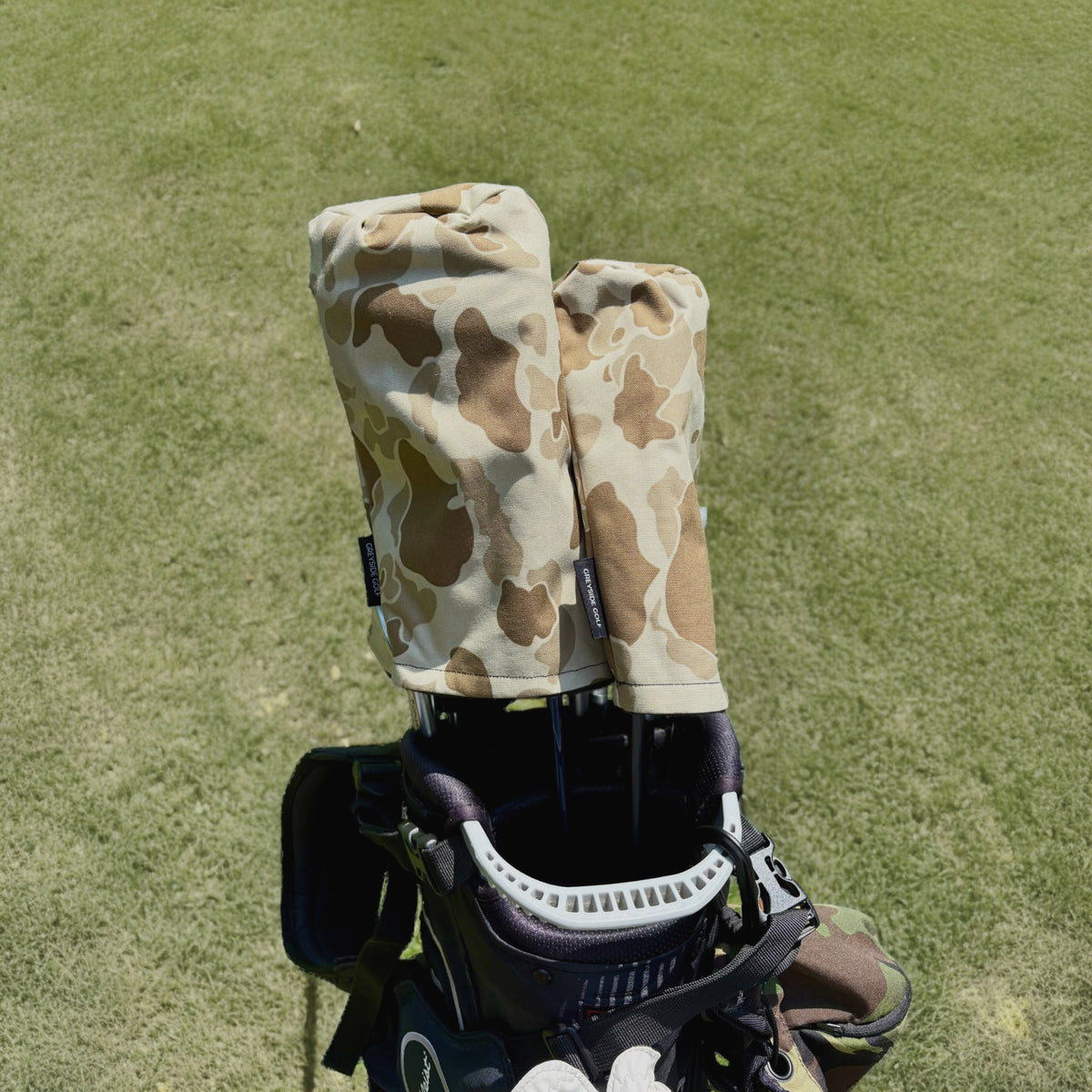 The Beach Side desert frogskin camo headcovers on driver and wood in golf bag on course